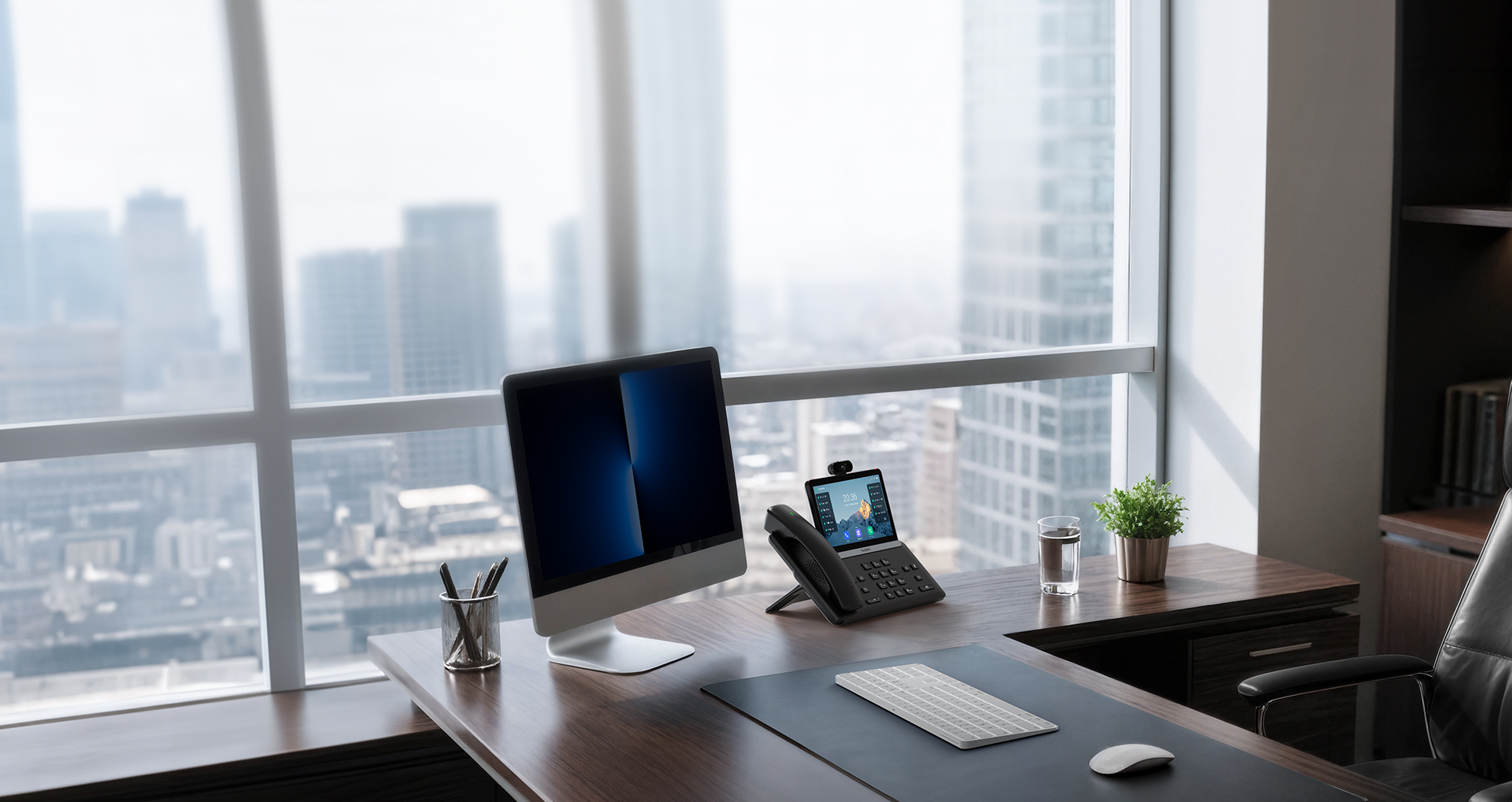 Yealink desk phone on a working office desk